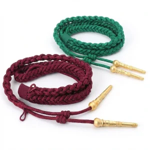 ceremonial-whistle-lanyards-dress : Close-up detail of hand-braided metallic ceremonial whistle lanyard showing ornamental end caps for dress uniforms