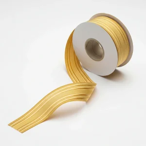 Close-up detail of gold bullion braid lace showing intricate weaving for military dress uniforms